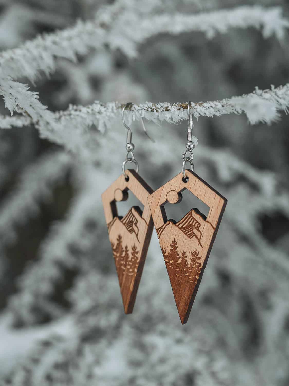 Wooden earrings on the mountain and fir trees theme