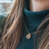 wooden necklace in the shape of the planet earth