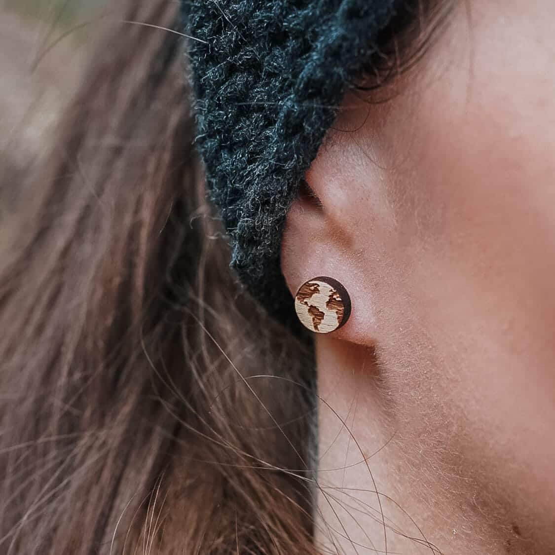 Wooden stud earrings in the shape of the planet Earth