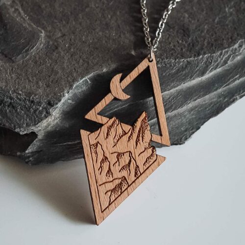Wooden necklace with mountains, moon and sun