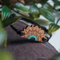 Green wooden bracelet inspired by mandalas