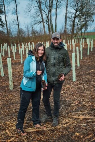 Damien and Laura planting trees