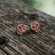 Wooden calavera ear studs - 4 Swiss wooden stud earrings with a winking Mexican skull design