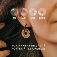 Explanation of the Swiss wooden hoop earrings with a hidden symbol saying "Life is beautiful"