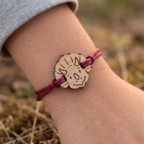Customizable Swiss wooden dinosaur bracelet with burgundy cord